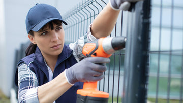 Lady installing fence