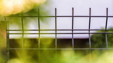 Welded mesh fence with shrubbery