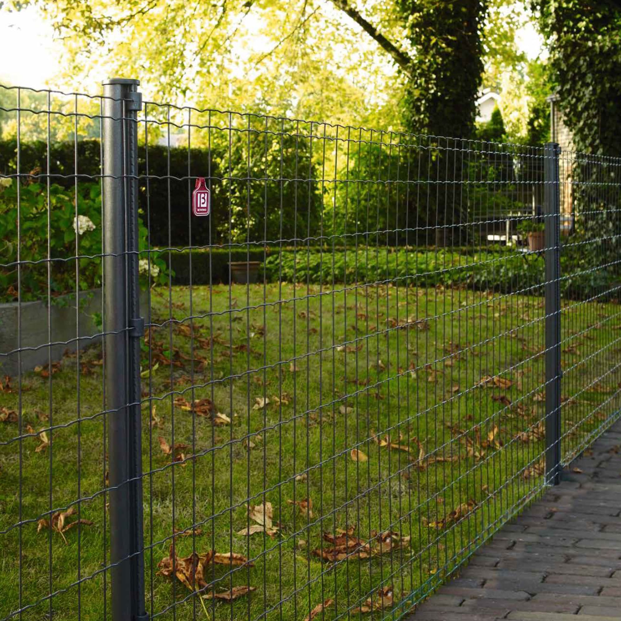 Lawn with green mesh fencing